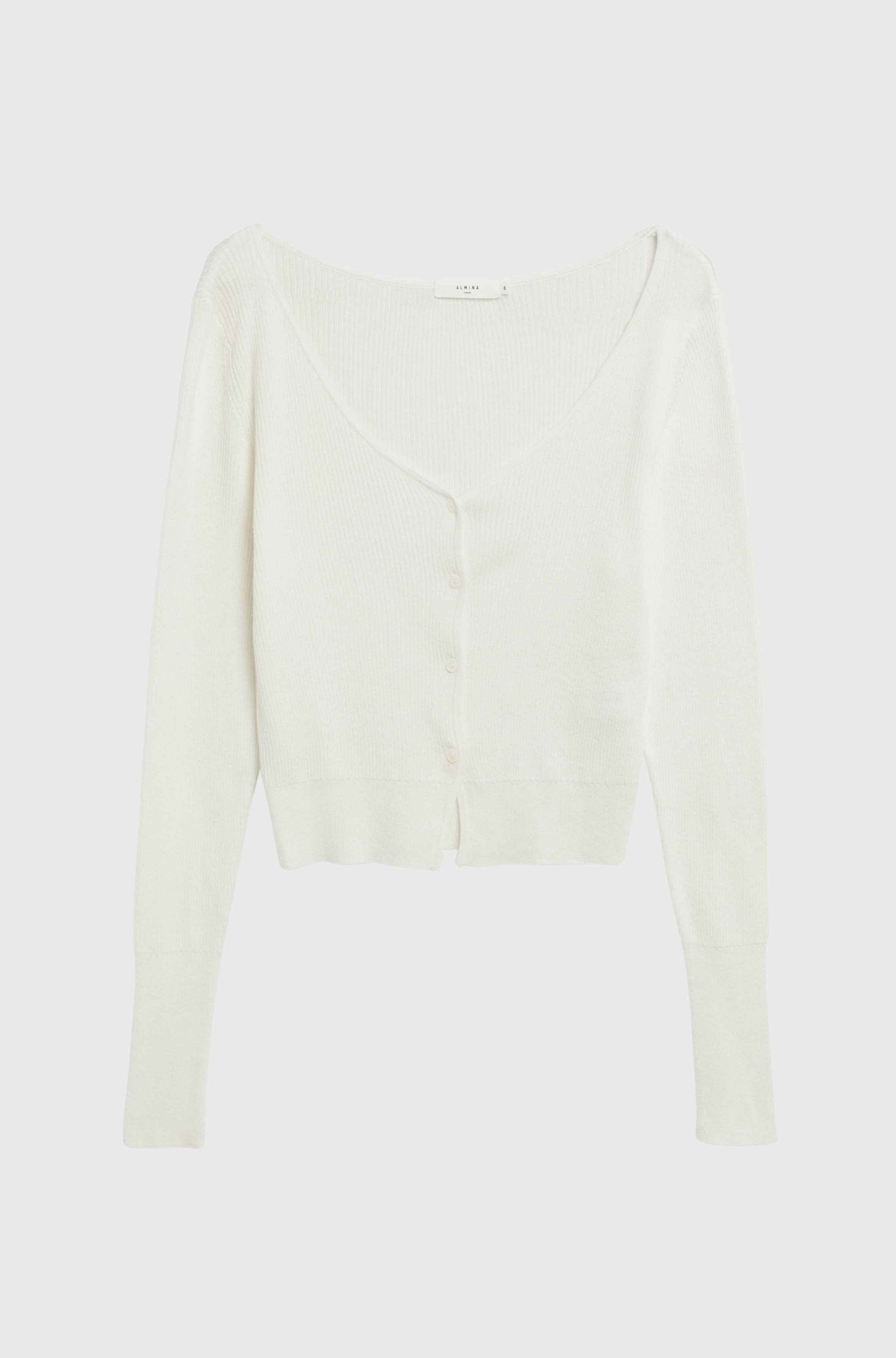 White long-sleeve top on a light gray background
