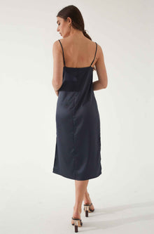 Woman wearing a blue silk dress