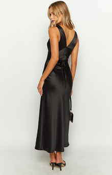 Rear-side view of a black satin maxi dress with a V-neck back and tie-back waist detail