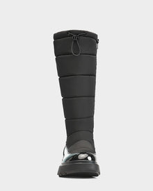 Front view of the Rudsak CLAUDE - L223506 Black women’s tall quilted winter boot, featuring a shiny waterproof lower, padded shaft with drawstring closure, and thick rubber sole for ultimate winter protection.