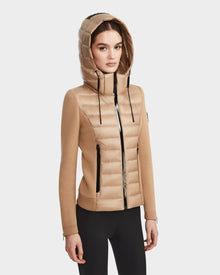 A woman wearing the RUDSAK MABS - 8122020 TOFFEE lightweight activewear jacket.