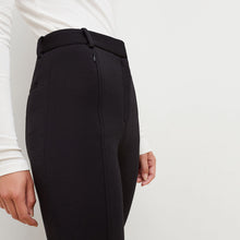 Detail image of a woman standing wearing the Curie Pant--Worth in Black