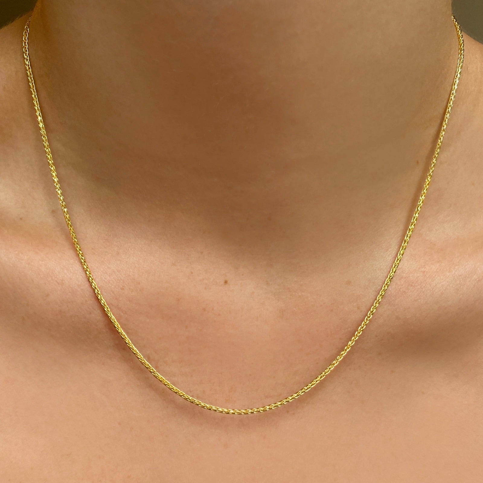 14k gold Wheat Chain Necklace on a neck 