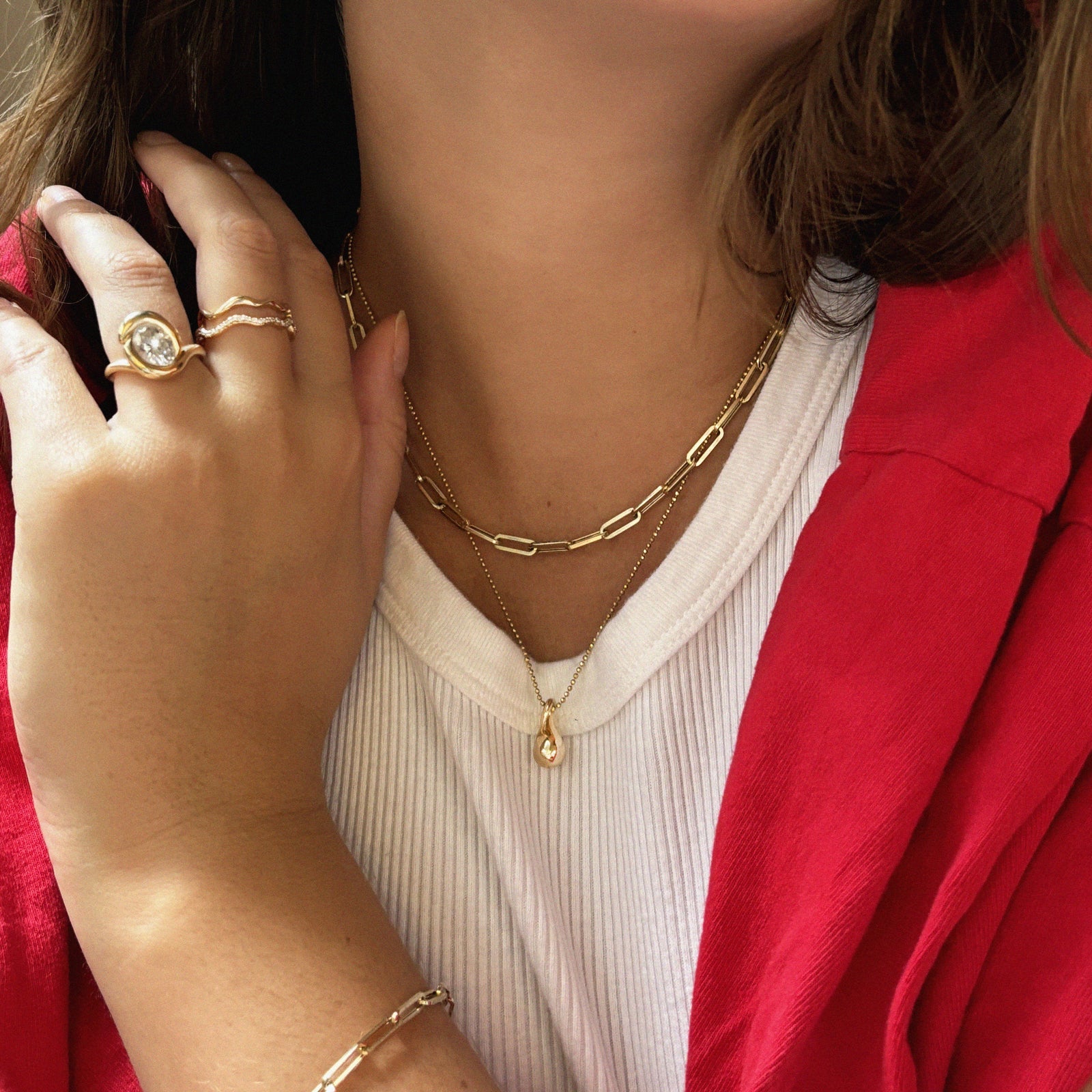 14k gold paperclip chain necklace styled with the Diamond Cut Bead Chain and the Gold Molten Drop Charm.