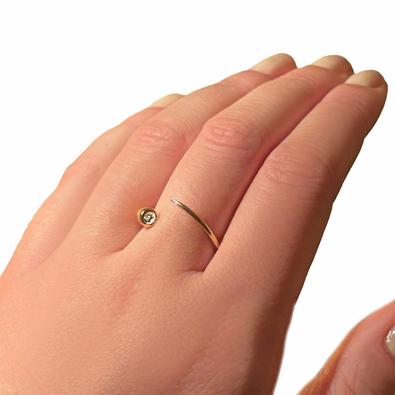 Quill Bypass Ring with 14k recycled gold and a diamond detail. 