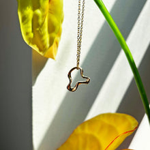 14k recycled gold Plain Ripple Charm styled on a Diamond Cut Cable chain 