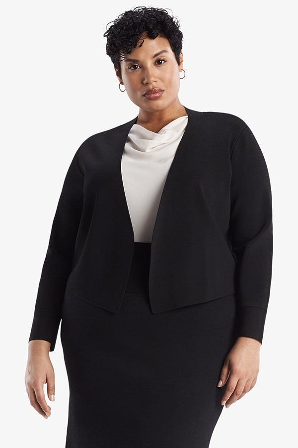 Front image of a woman standing wearing the Sant Ambroeus jardigan in black | Plus | Exclude